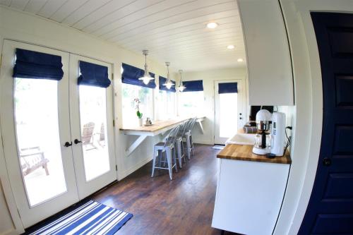 a kitchen with a counter and some windows and a counter top at The Ledges Resort & Marina in Alexandria Bay