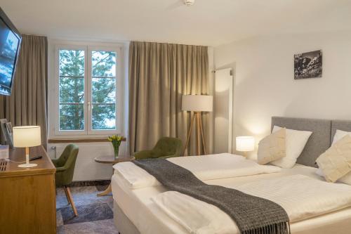 Llit o llits en una habitació de De France by Thermalhotels