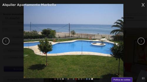 a rendering of a swimming pool next to the beach at Apartamento Marbella Playa in Marbella