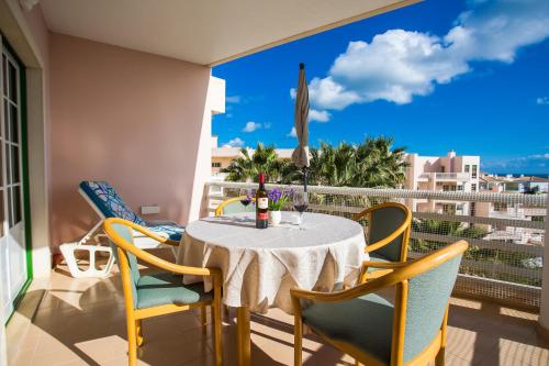 a table and chairs on a balcony with a view at Vau Seaview Apartment in Portimão