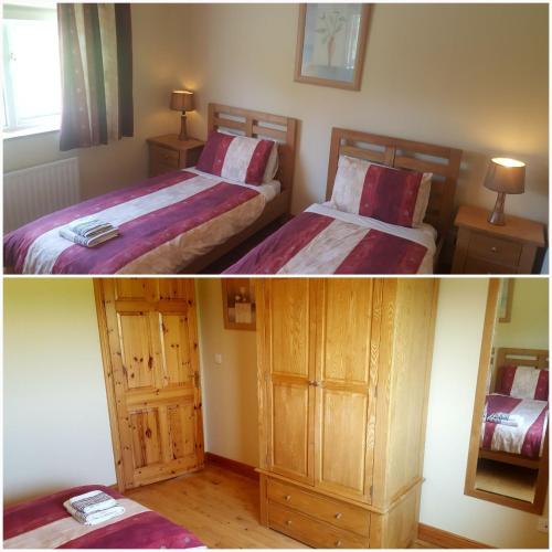 a bedroom with two beds and a mirror at Large Luxury House in Ballyell