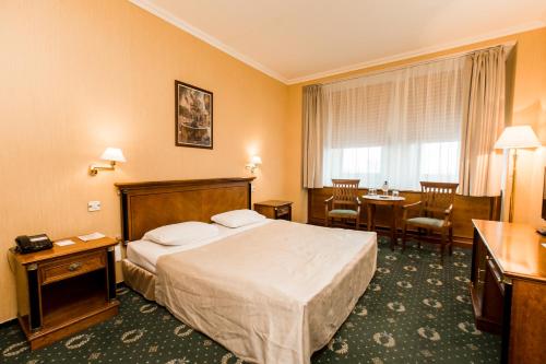 Säng eller sängar i ett rum på AZIMUT Hotel Yakutsk