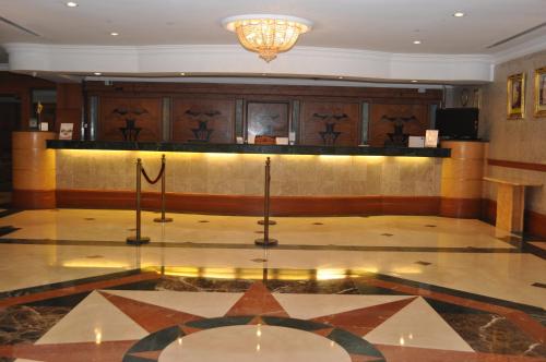 a lobby with a star on the floor of a building at Mulia Hotel in Bandar Seri Begawan