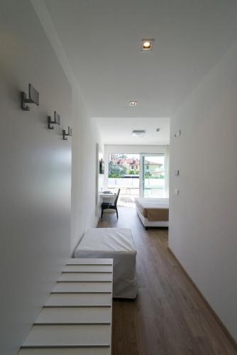 a living room with a staircase leading to a bedroom at Hotel Villa Katy in Bardolino