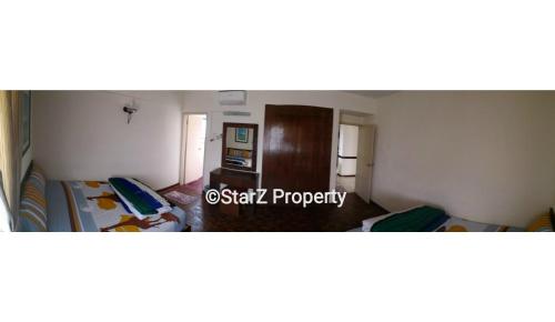 a room with two beds in a room at D Savoy A Famosa Condominium in Melaka