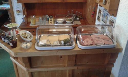 a counter with two trays of food on it at Landhaus Aigner in Mittersill