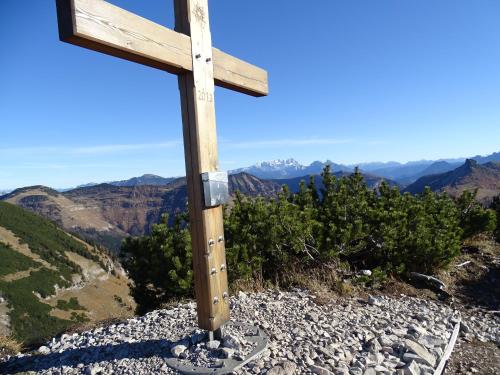 a wooden cross sitting on top of a mountain at Pension Bayrhammer in Faistenau