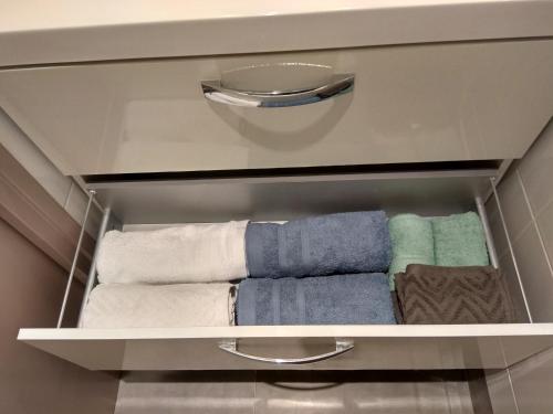 a towel rack with towels and towels in a bathroom at Chic apart in Paris in Saint-Denis