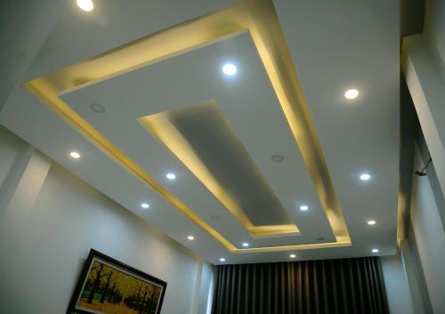 a coffered ceiling in a room with a window at Khoi Nguon in Da Nang