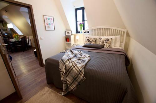 a bedroom with a large bed in a room at 7 Koron - Exclusive Apartments in Kraków