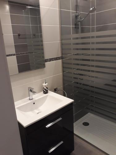 a bathroom with a sink and a shower at modern holiday apartment with private pool in Adeje