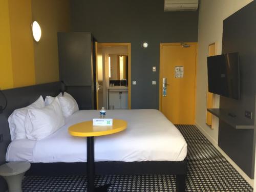 Ένα ή περισσότερα κρεβάτια σε δωμάτιο στο ibis Styles Marseille Vieux Port