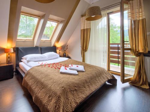 Posteľ alebo postele v izbe v ubytovaní VisitZakopane - Mango Apartment