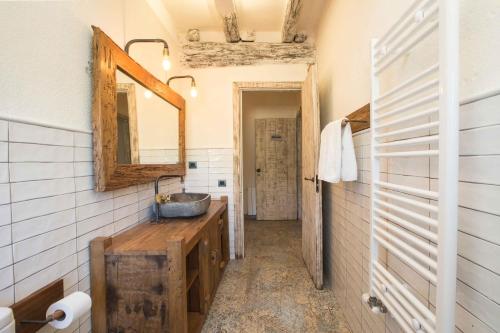 a bathroom with a sink and a mirror at Mas del Sord 1335 in La Selva del Camp
