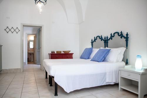 Giường trong phòng chung tại Masseria Villa