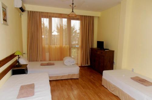 Кровать или кровати в номере Guest House Misha