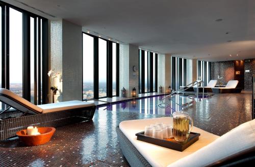 a living room with a view of a building at Eurostars Madrid Tower in Madrid