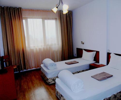 Кровать или кровати в номере Guest House Misha