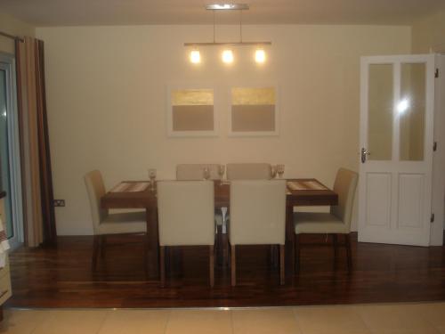 a dining room with a table and chairs at 33 ArdMullen Townhouse X Davitt's Guesthouse & Restaurant Kenmare in Kenmare