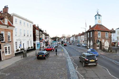 a city street with cars parked on the street at OutRam 26 in Stockton-on-Tees