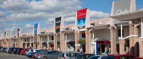 a row of cars parked in front of a dealership at OutRam 26 in Stockton-on-Tees