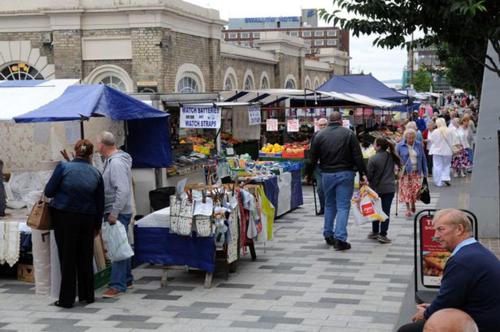 a group of people walking around an outdoor market at OutRam 26 in Stockton-on-Tees