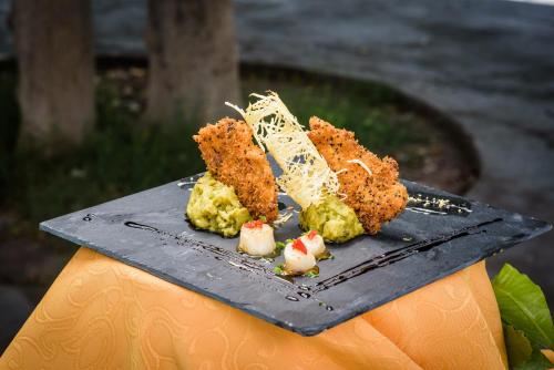 a plate of food on top of a table at Hotel del Valle Azapa in Arica
