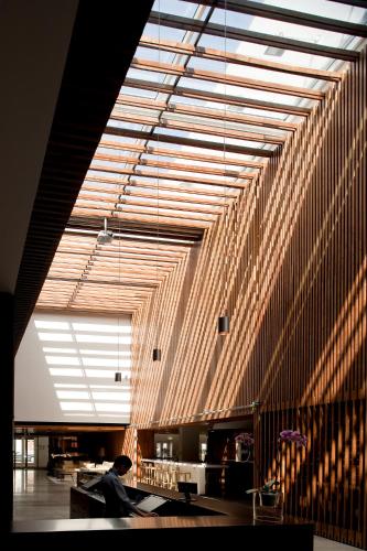 a large room with wooden walls and a large ceiling at Inspira Liberdade Boutique Hotel in Lisbon