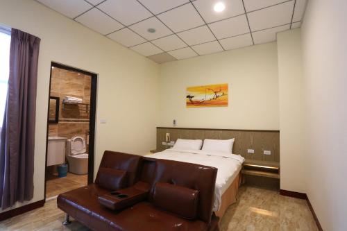 Ένα ή περισσότερα κρεβάτια σε δωμάτιο στο ChangJu Hotel