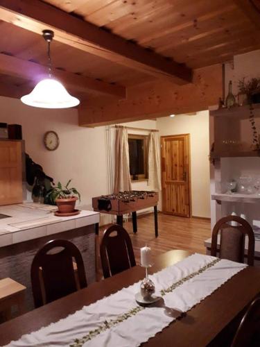 a dining room with a table and a tableablish at U Edyho in Zuberec