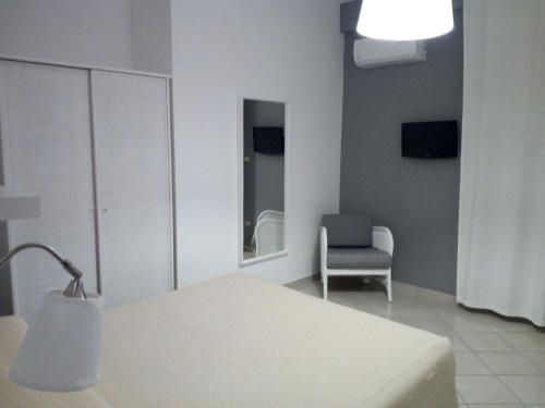 Tempat tidur dalam kamar di Mini Hotel - Angolo Di Paradiso -