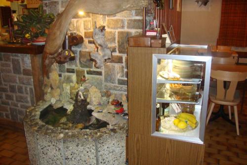 an open refrigerator next to a stone wall at Bietschhorn in Kippel