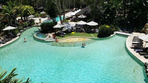 an overhead view of a swimming pool at a resort at Temple 121 Modern Spacious Palm Cove 2 Brm 2 Bth Resort Apartment With Courtyard in Palm Cove