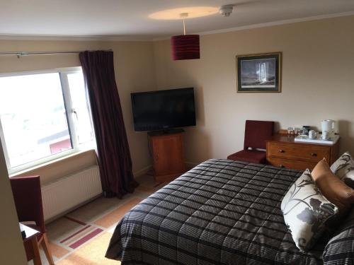 Postel nebo postele na pokoji v ubytování Malvina House Hotel