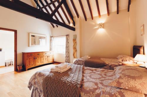 a bedroom with two beds and a window at Quay Quarters in Chichester