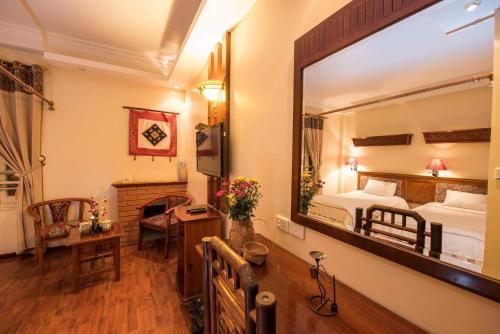 Giường trong phòng chung tại Thai Binh Sapa Hotel