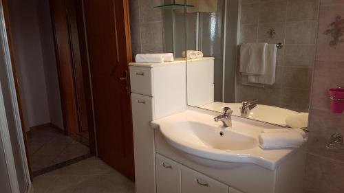 Ett badrum på Rooms & Apartments Giulia