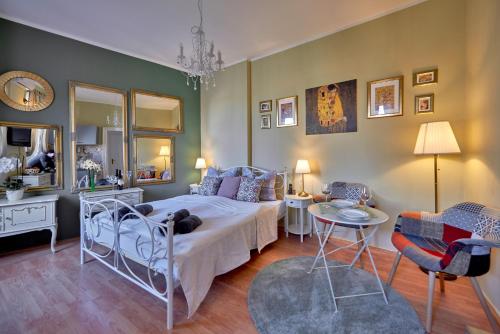 a bedroom with a bed with a dog laying on it at Old City Romantic Studio with FREE private parking in Pula