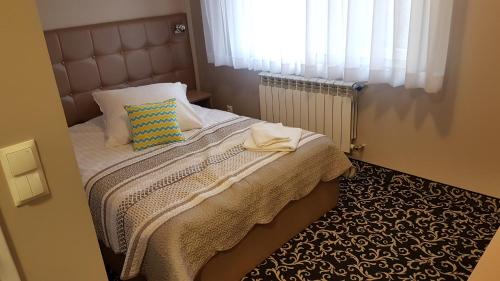מיטה או מיטות בחדר ב-Hotel Gutland