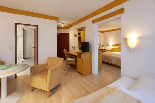 Ένα ή περισσότερα κρεβάτια σε δωμάτιο στο Hotel Kastanienhof