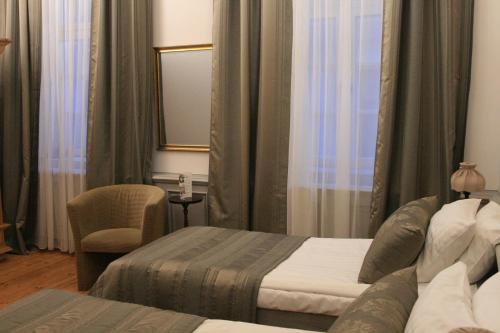 Postel nebo postele na pokoji v ubytování Boutique Hotel KRISTOFS