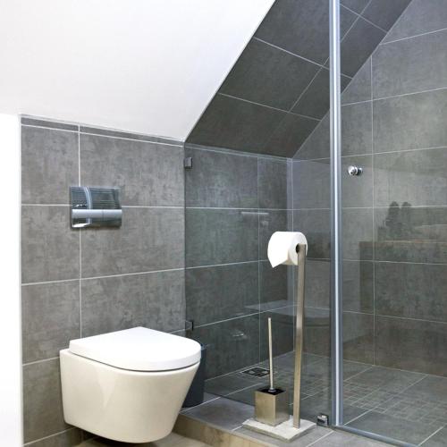 a bathroom with a toilet and a shower at Shambala Apartman Tihany in Tihany