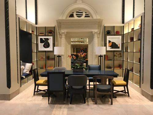 a dining room with a blue table and chairs at Hotel Spero, Vignette Collection by IHG in San Francisco