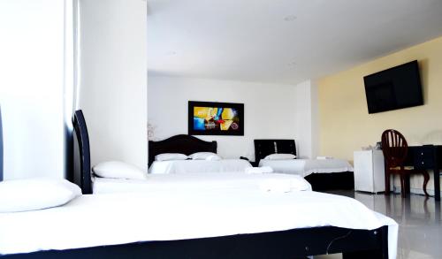 Postel nebo postele na pokoji v ubytování Hotel Intersuites