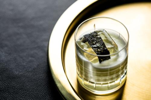 a glass on a plate with a piece of cake at Hotel Bijou - Union Square in San Francisco