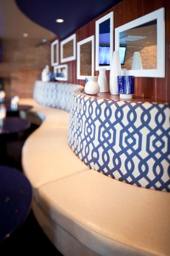 a row of tables with vases on top of them at Nationwide Hotel and Conference Center in Lewis Center