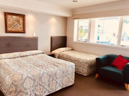 Postel nebo postele na pokoji v ubytování Phoenix Palm Motel