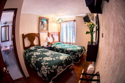 Postel nebo postele na pokoji v ubytování Hotel posada casa regia
