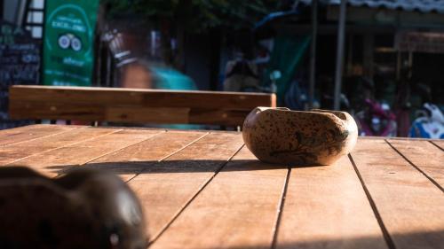 a bowl sitting on top of a wooden table at AVA Boutique Guesthouse in Koh Tao