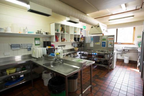 a kitchen with a lot of counter space at Thredbo YHA in Thredbo